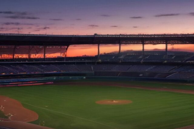 Estadio de béisbol vacío al atardecer con el diamante y el césped iluminados bajo un cielo naranja y morado, alusivo a la Serie Mundial 2026